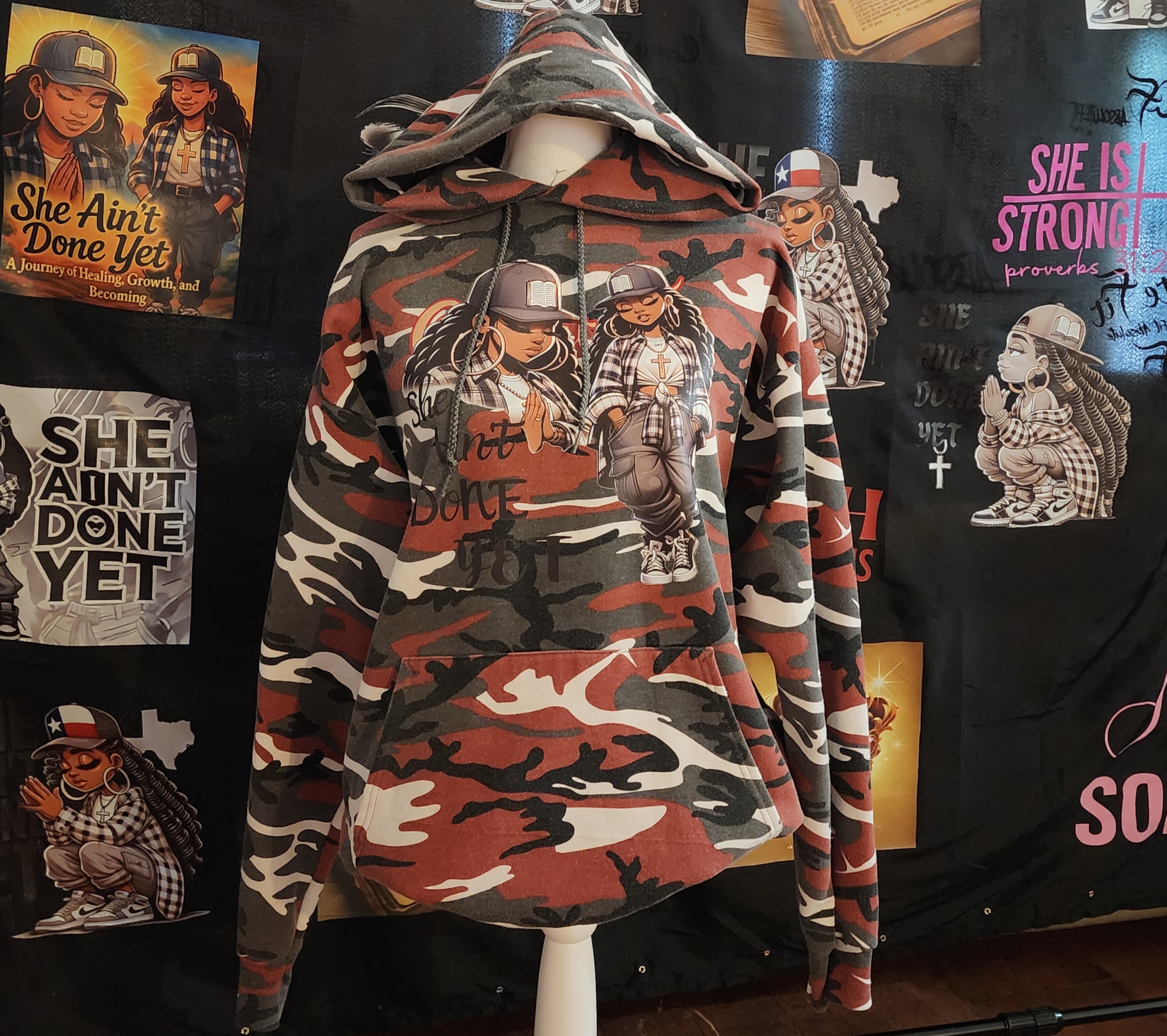 SHE AIN’T DONE YET – Camouflage Hoodie