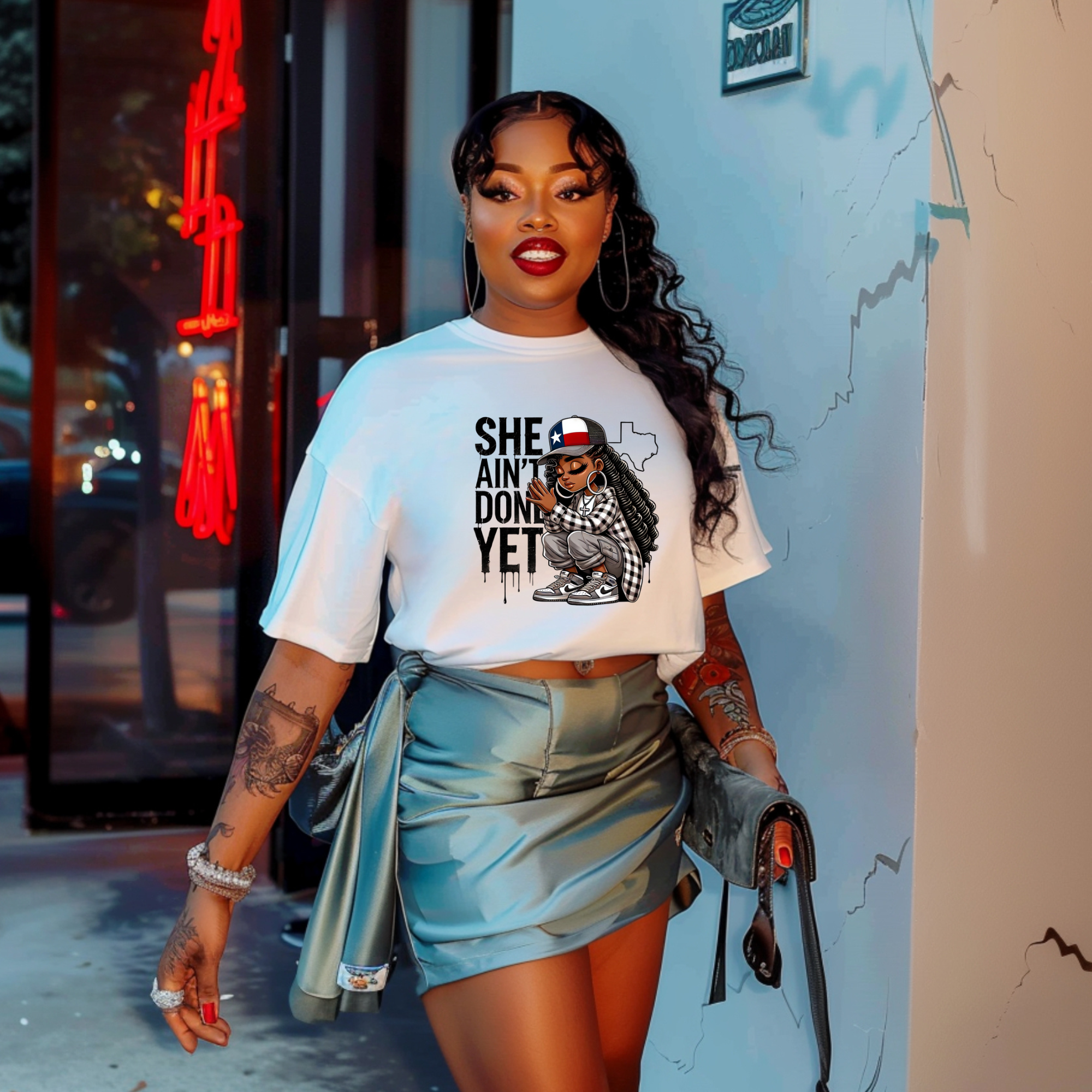 SHE AIN’T DONE YET –  T-Shirt